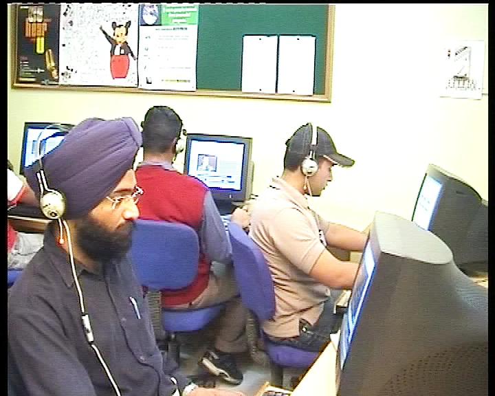 Students practicing listening and communication skills in the English Language Lab at Dashmesh Academy, Amritsar.